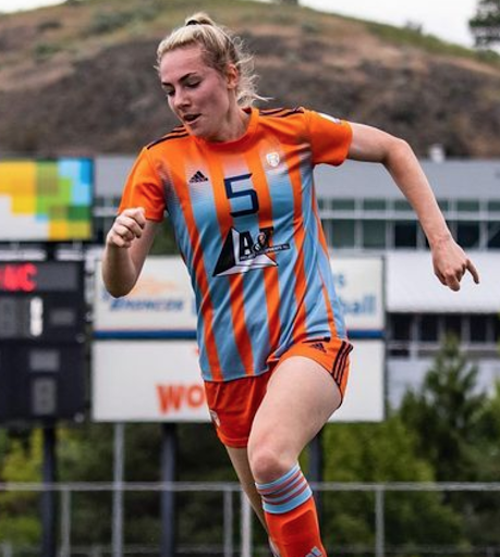 A player wears Rivers FC orange and blue stripes.